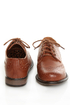The Dollhouse Trickster Chestnut Brogue Lace-Up Oxfords are the quickest trick to a flawless \\\'fit! Tan vegan leather oxfords with brogue details and coated shoestrings.