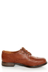 The Dollhouse Trickster Chestnut Brogue Lace-Up Oxfords are the quickest trick to a flawless \\\'fit! Tan vegan leather oxfords with brogue details and coated shoestrings.