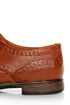 The Dollhouse Trickster Chestnut Brogue Lace-Up Oxfords are the quickest trick to a flawless \\\'fit! Tan vegan leather oxfords with brogue details and coated shoestrings.