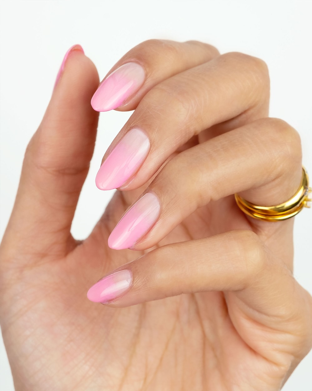 blush and candy pink ombre nails on a hand