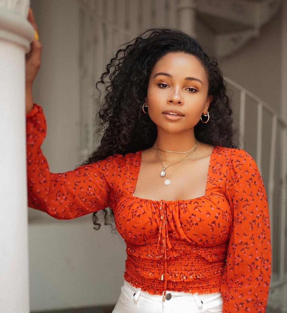 woman in red blouse