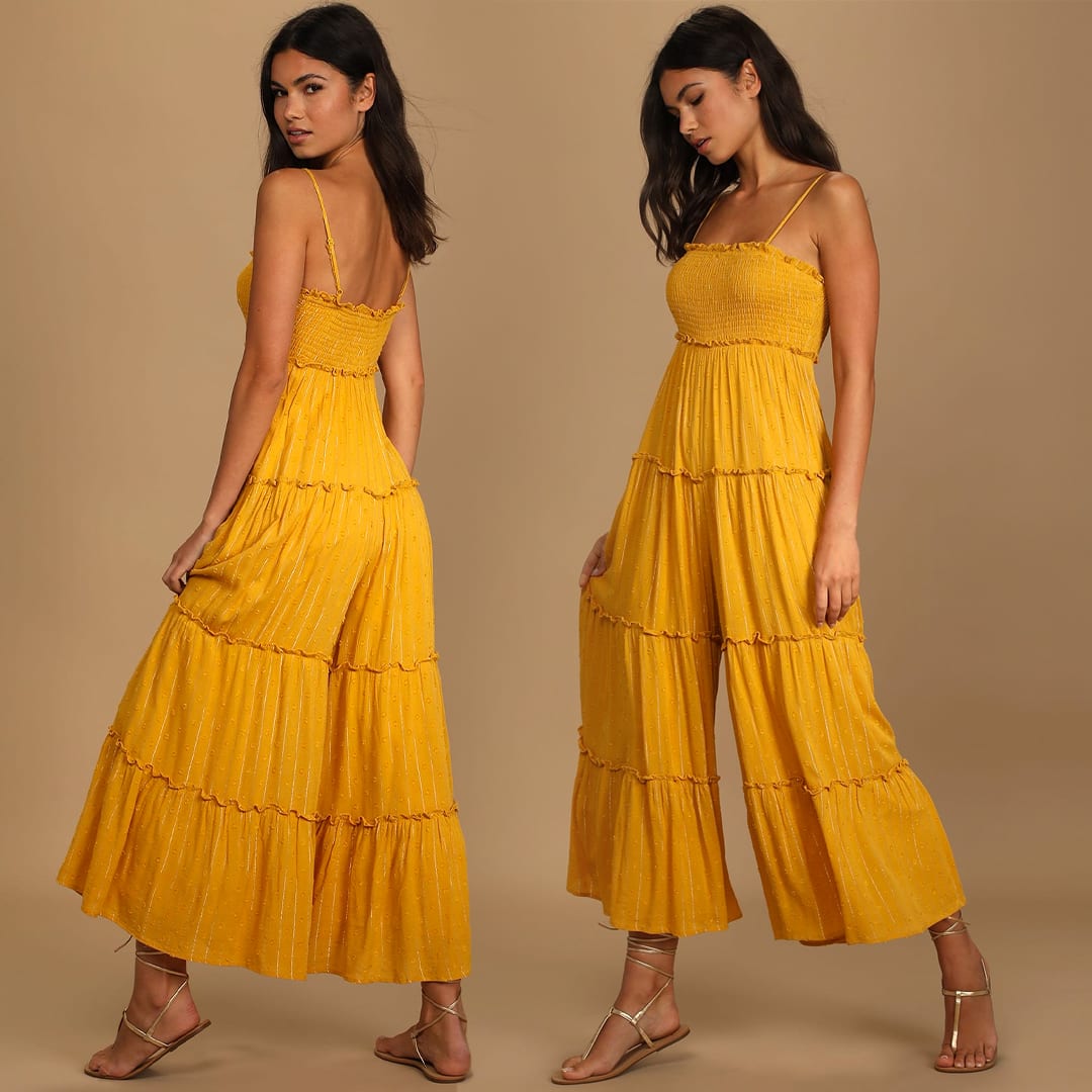 a model wearing a mustard yellow smocked jumpsuit