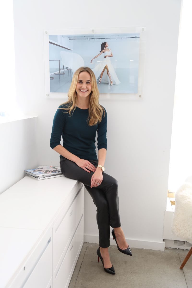 the knot editor in chief Kristen Maxwell Cooper sitting in all white office