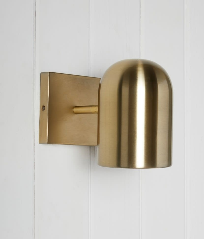 gold wall sconce for maximizing small spaces