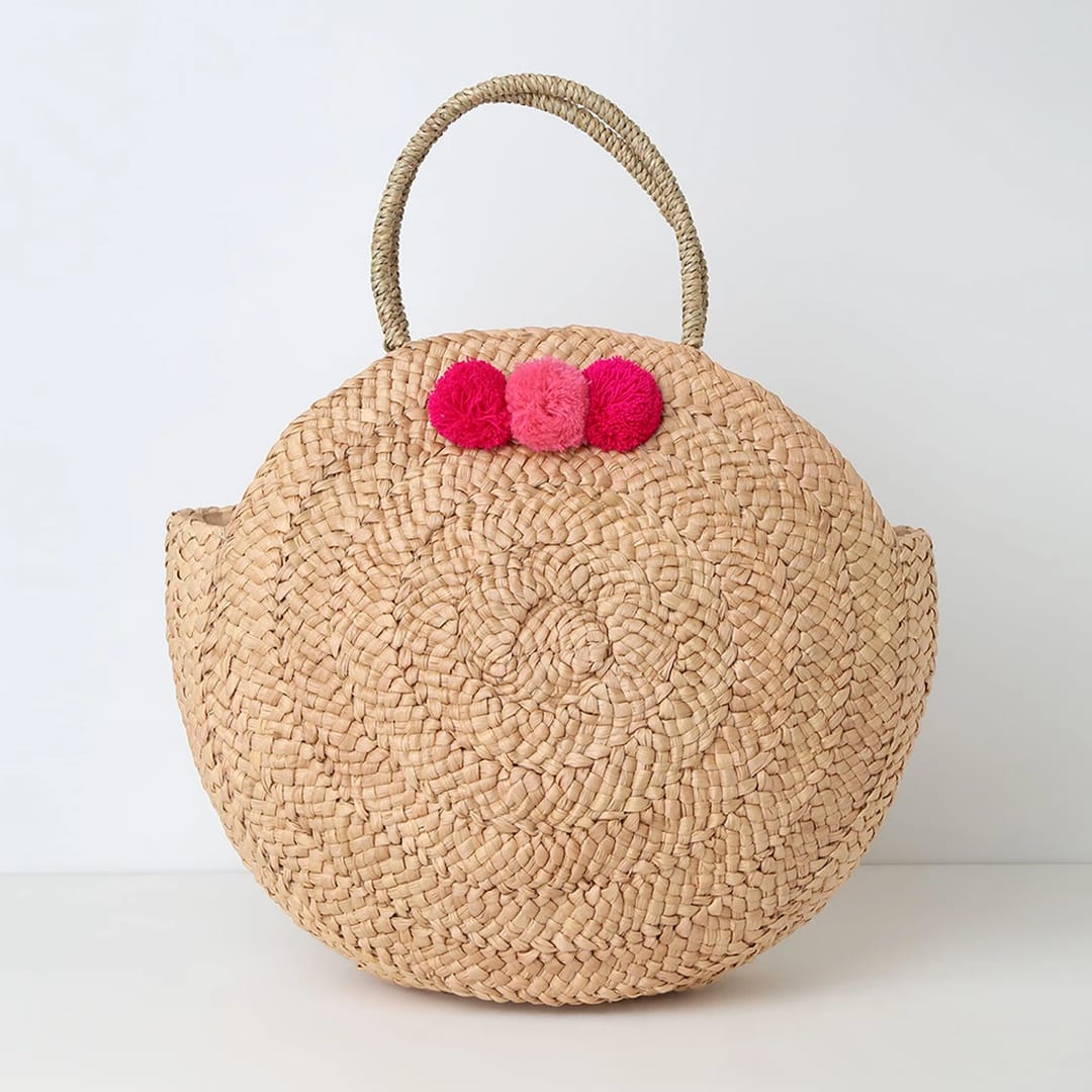 woven straw tote: pom pom tote