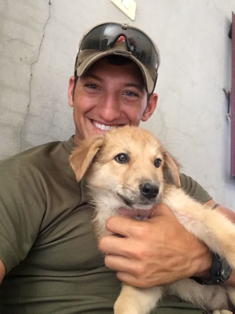 soldier and dog reunion photo: SPCAI staff and dog rescue: pets and mental health - pets for depression and anxiety - how do dogs help with anxiety - dogs and emotional health