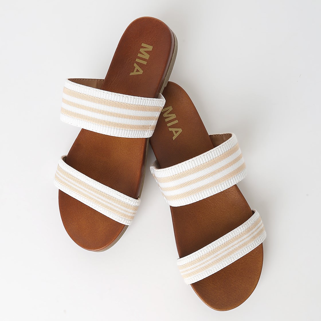 white and beige striped slides
