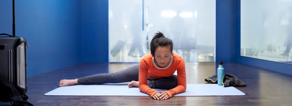 woman doing airport yoga