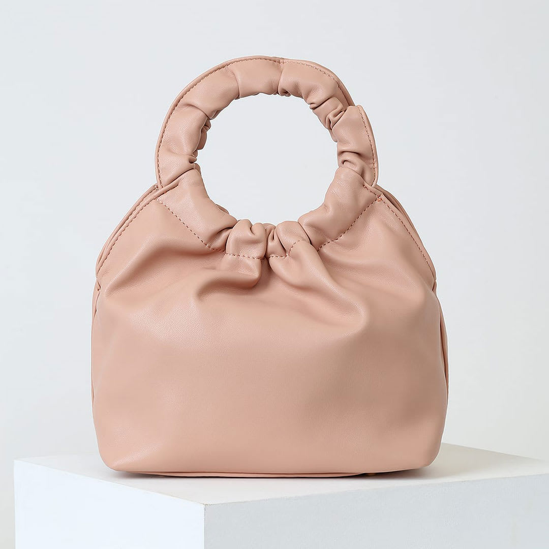 blush handbag as minimalist fashion