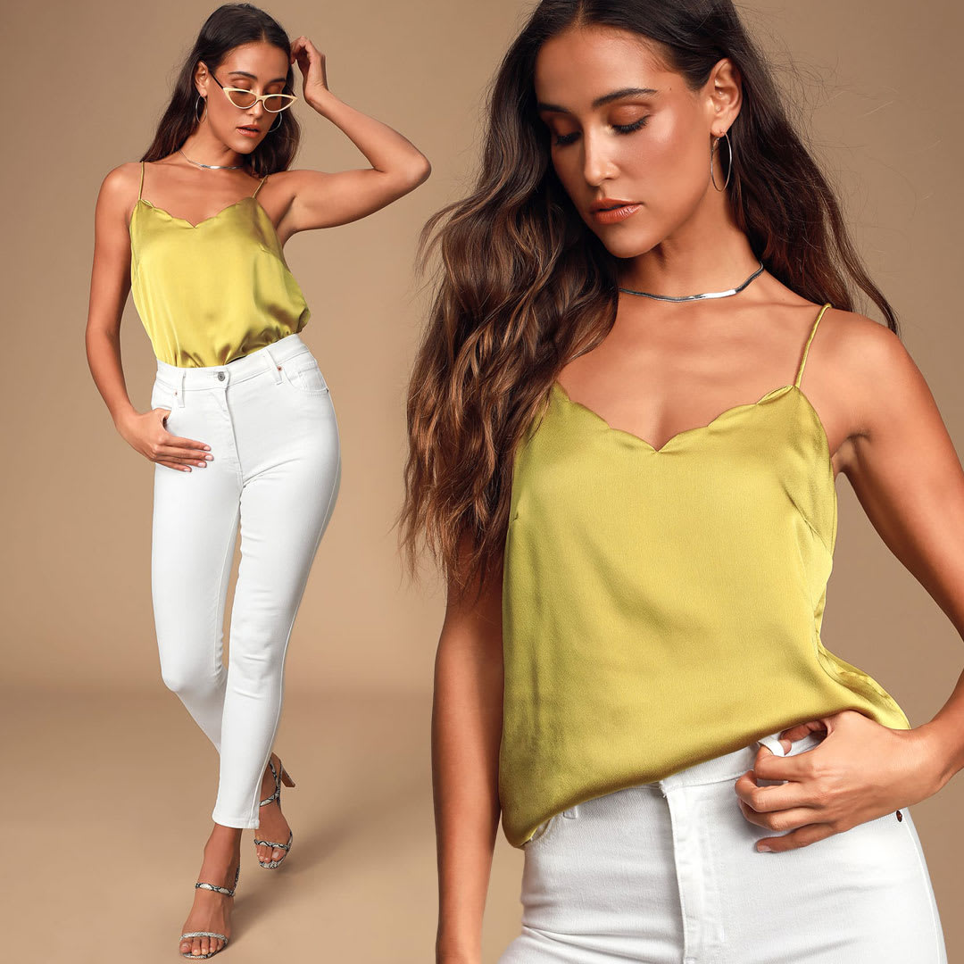 model wearing chartreuse satin cami with white jeans