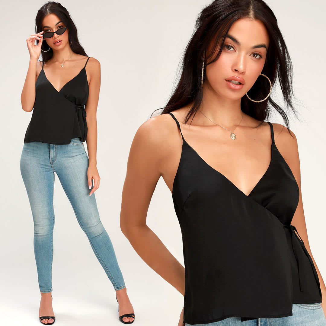model wearing a black satin wrap cami top with blue jeans
