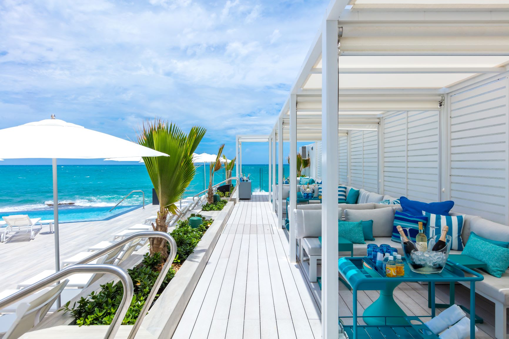 view of ocean and deck at Serafina hotel, of the best beach vacations in US
