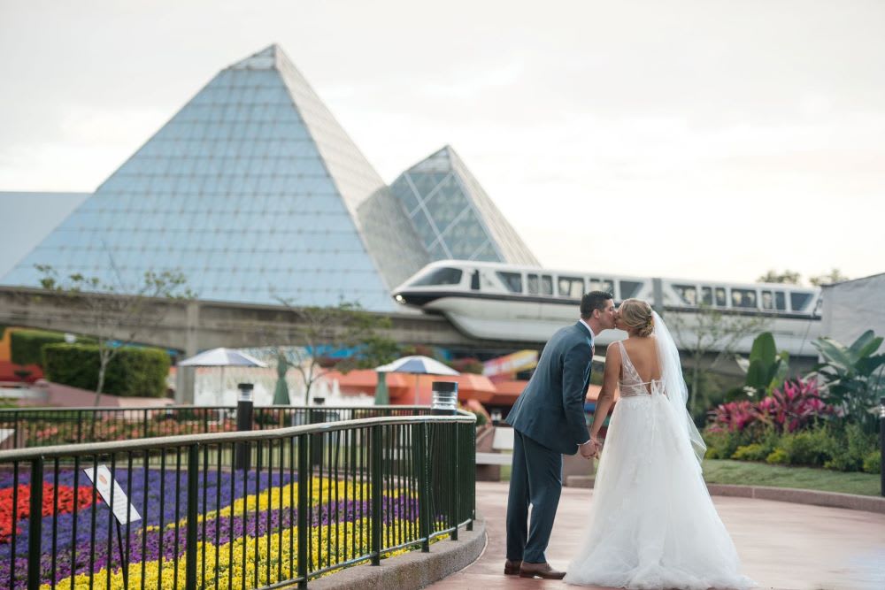 couple having a wedding at disney epcot center
