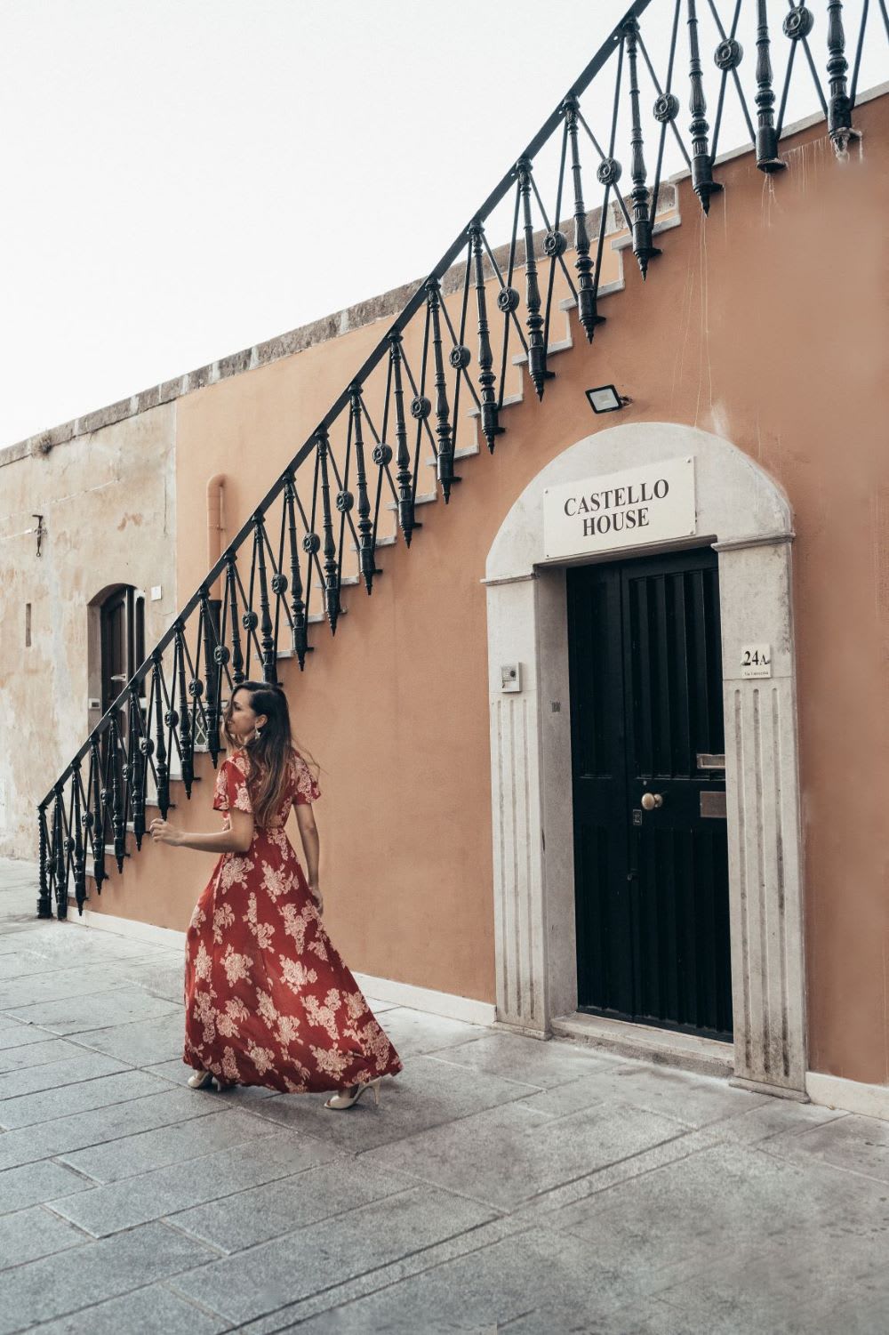 woman in floral maxi street showing things to do in sardinia street
