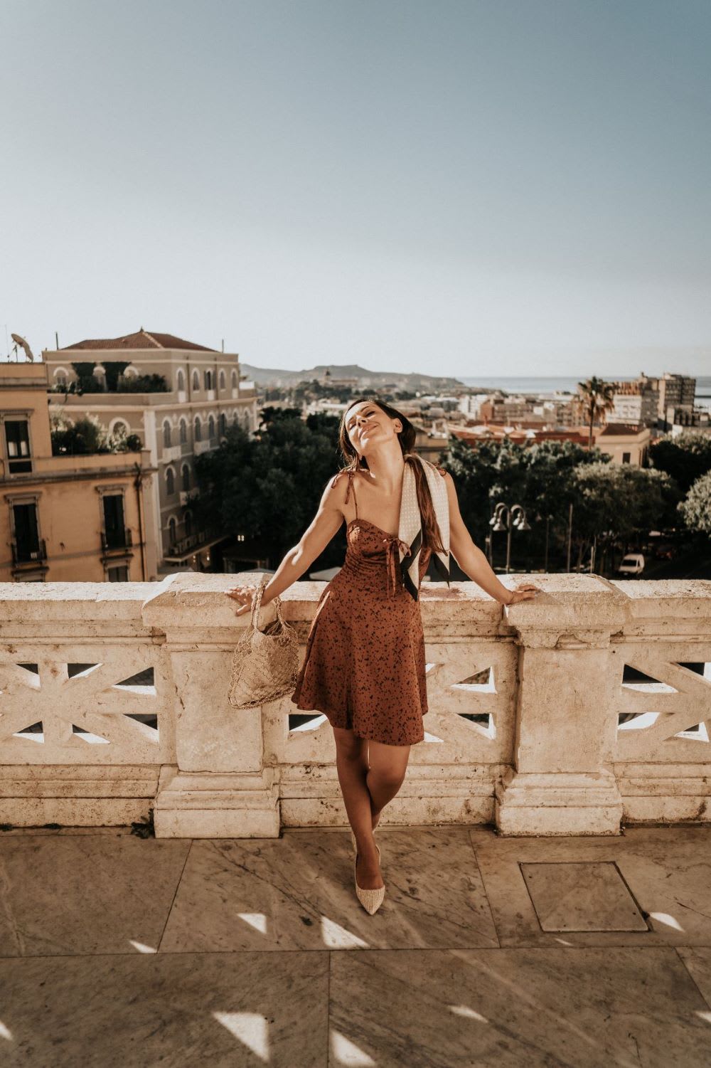 woman overlooking view: things to do in Sardinia