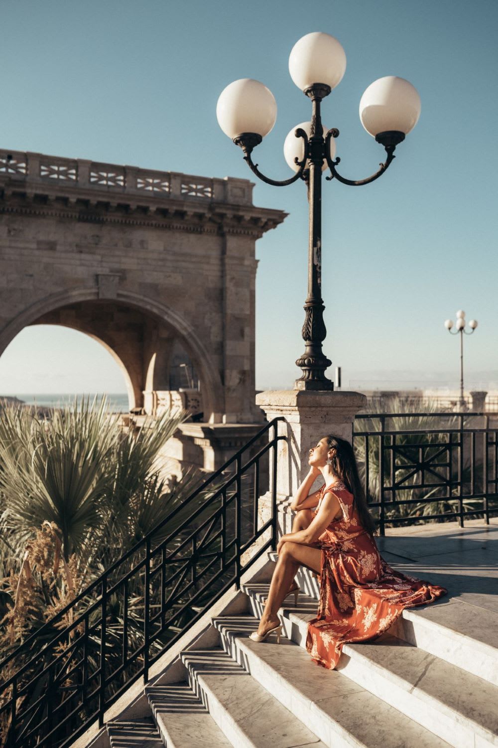 woman sitting on steps in sardinia