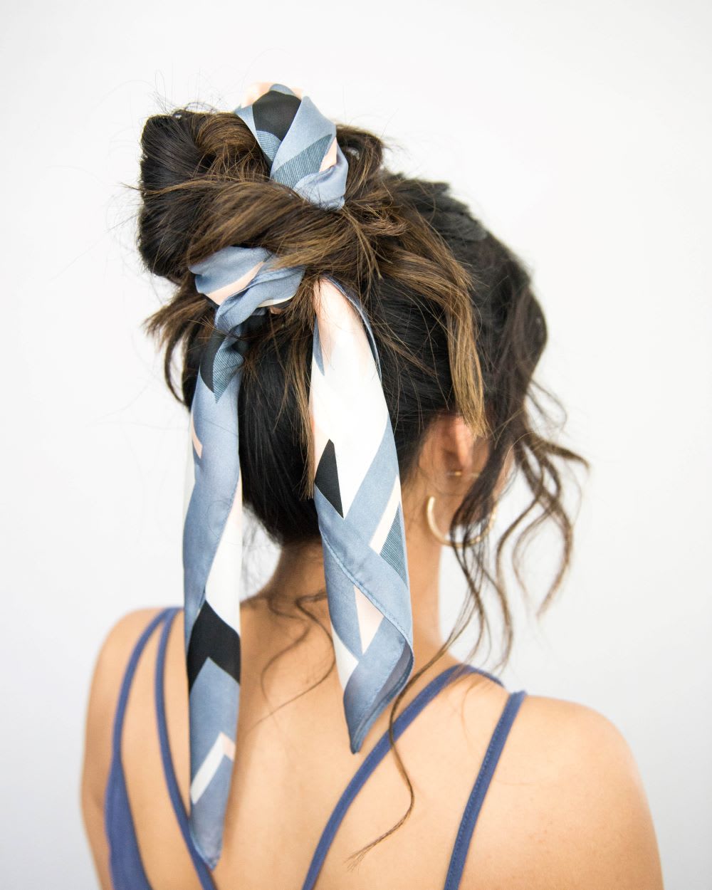 Image of Messy bun with scarf hairstyle