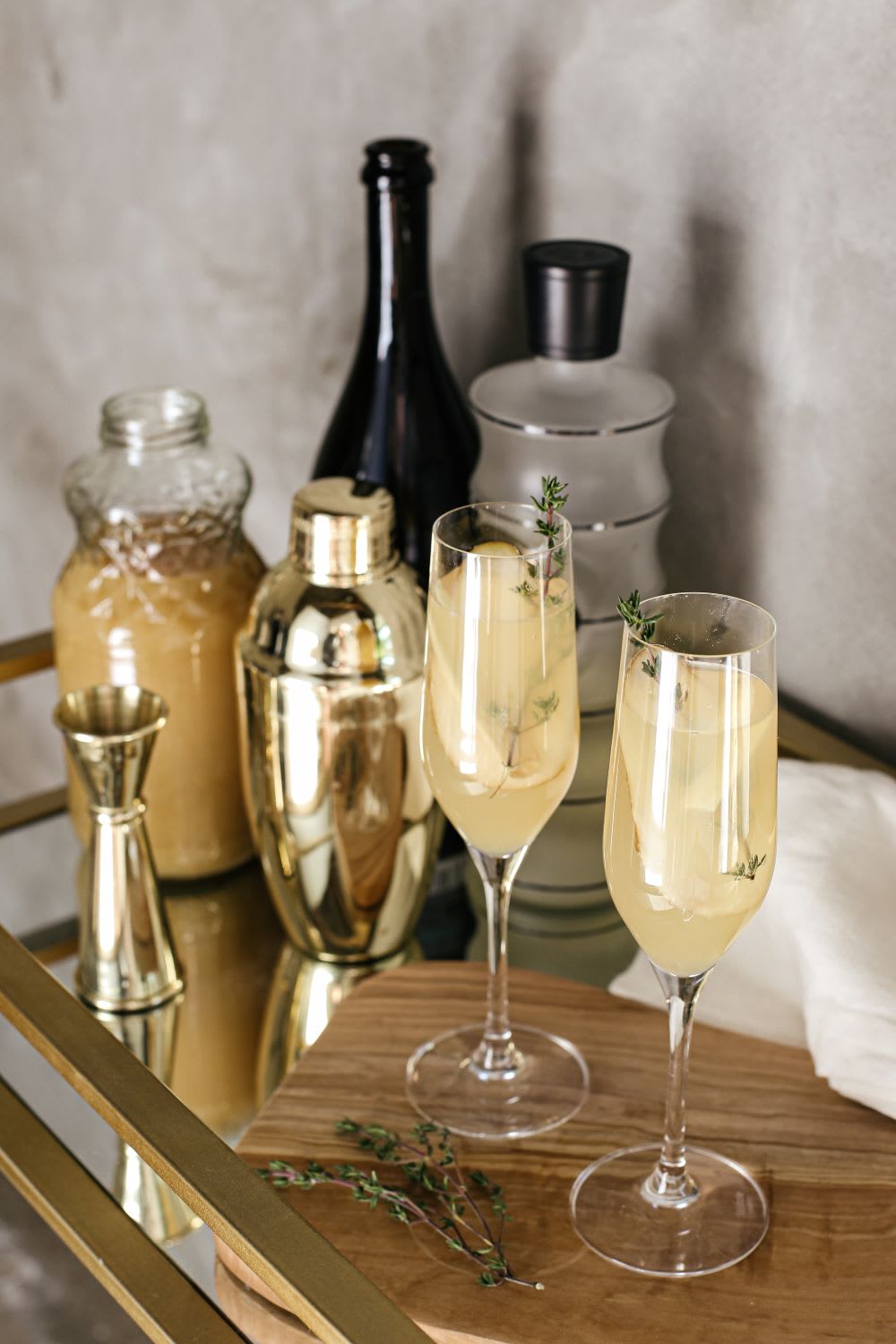sparkling pear mimosa in glasses on bar