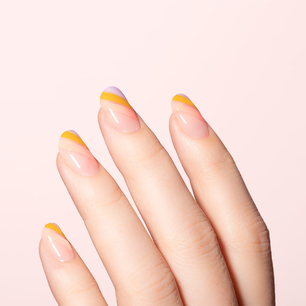 stripe nails in pink, lavender, and mustard yellow