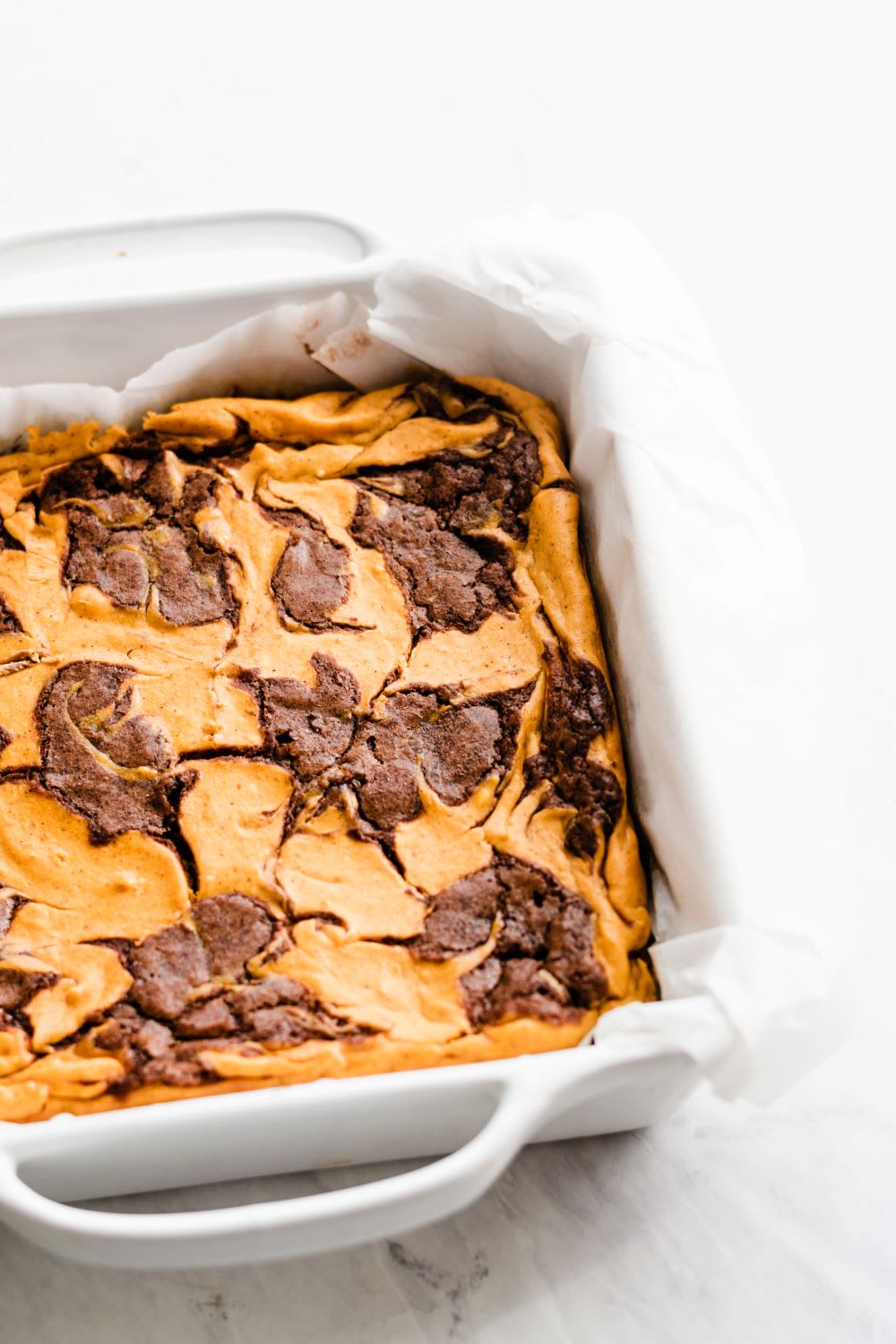 tray of pumpkin cheesecake brownies