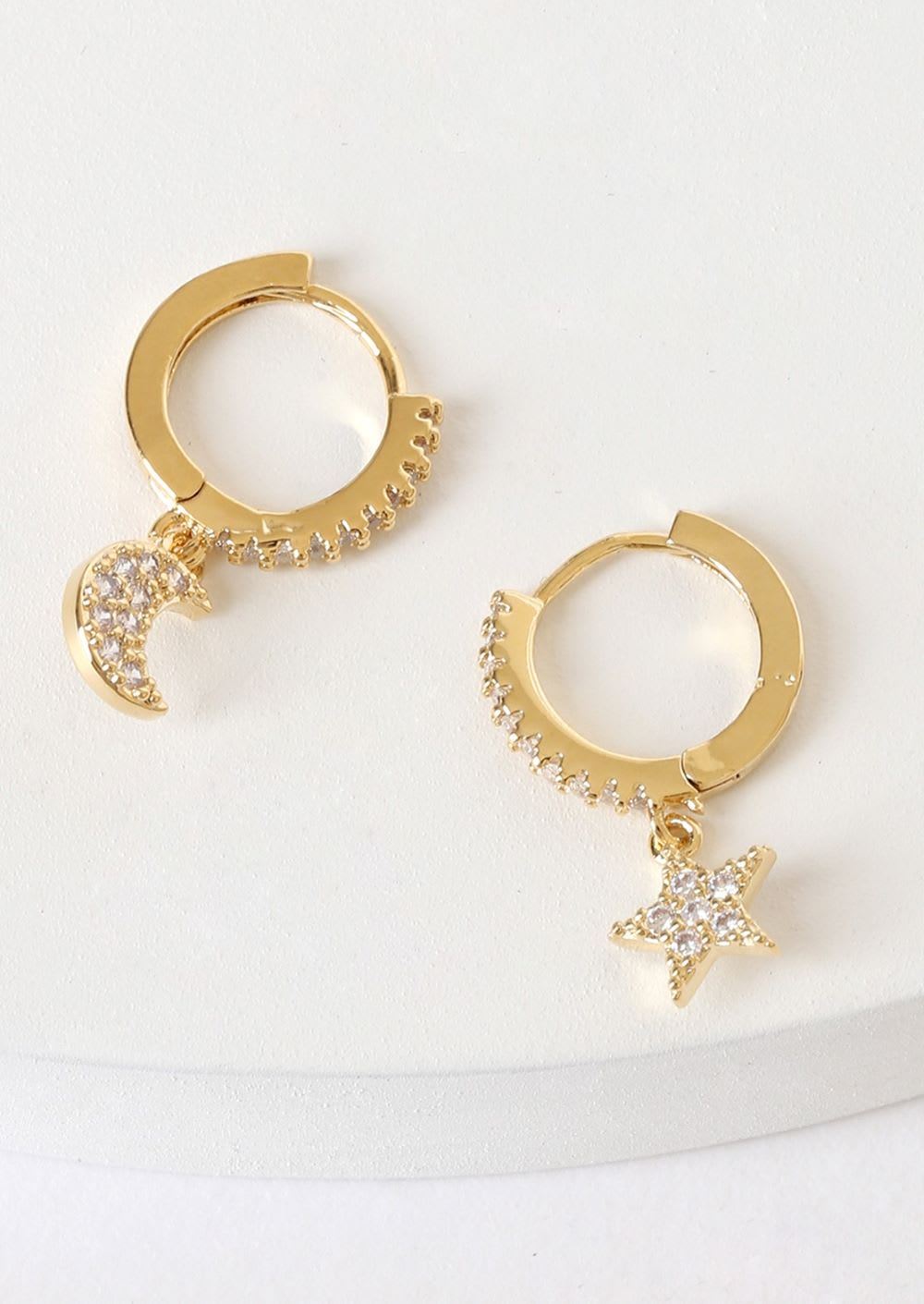 gold earrings with star and moon