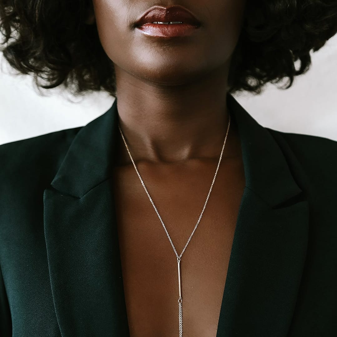 sexy y-necklace on model in blazer