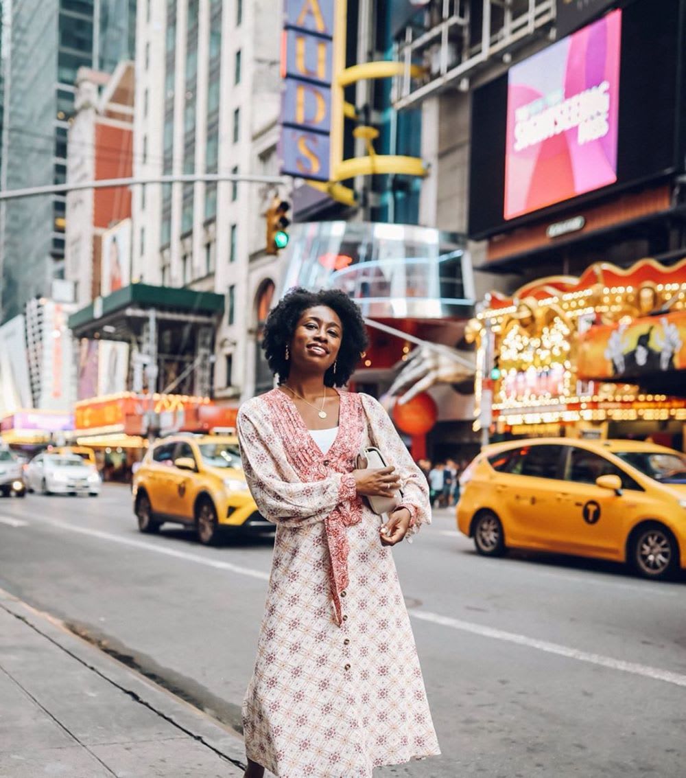 woman in printed dress in times square nyc