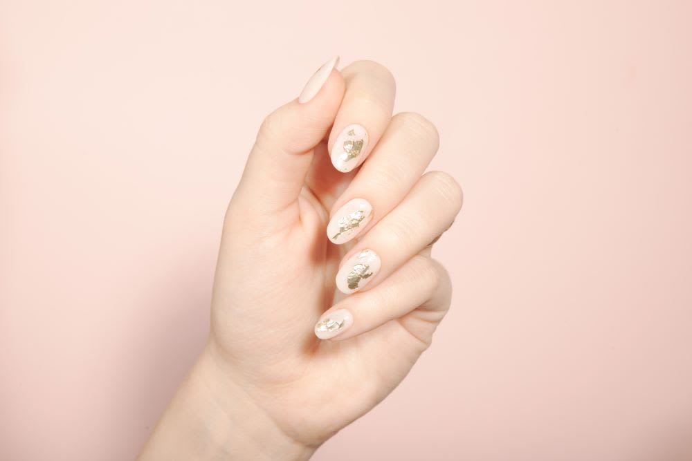 abstract nail art in nude and gold