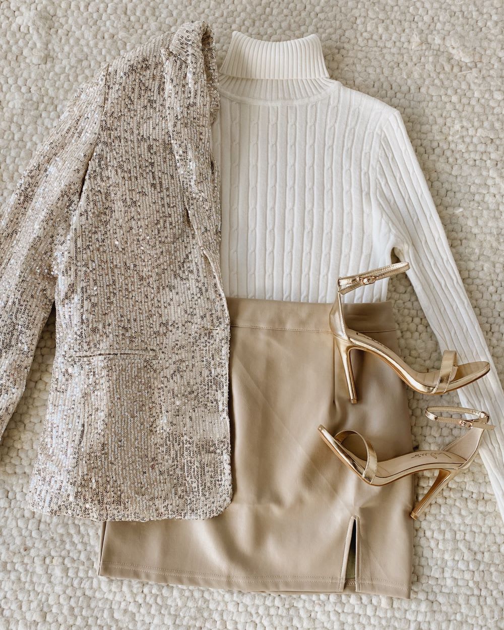 sequin blazer with white turtleneck sweater and gold vegan leather skirt and heels