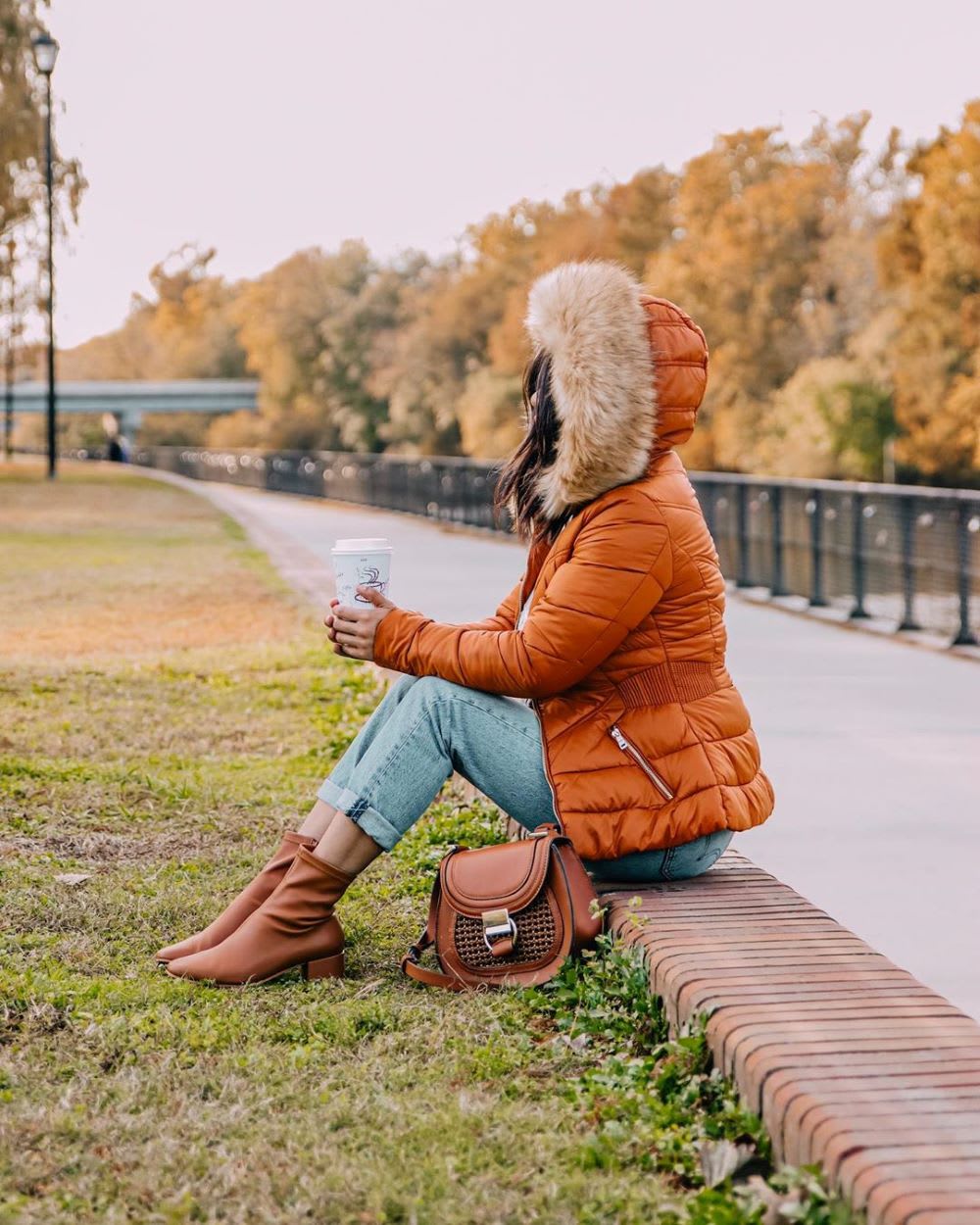 woman in puffer jacket as example of holiday grief: how to help someone grieving 