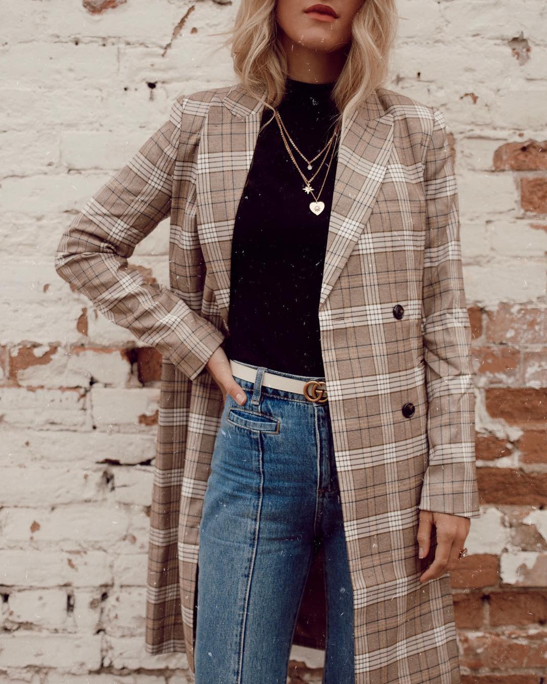 freelance business: woman in plaid coat and jeans