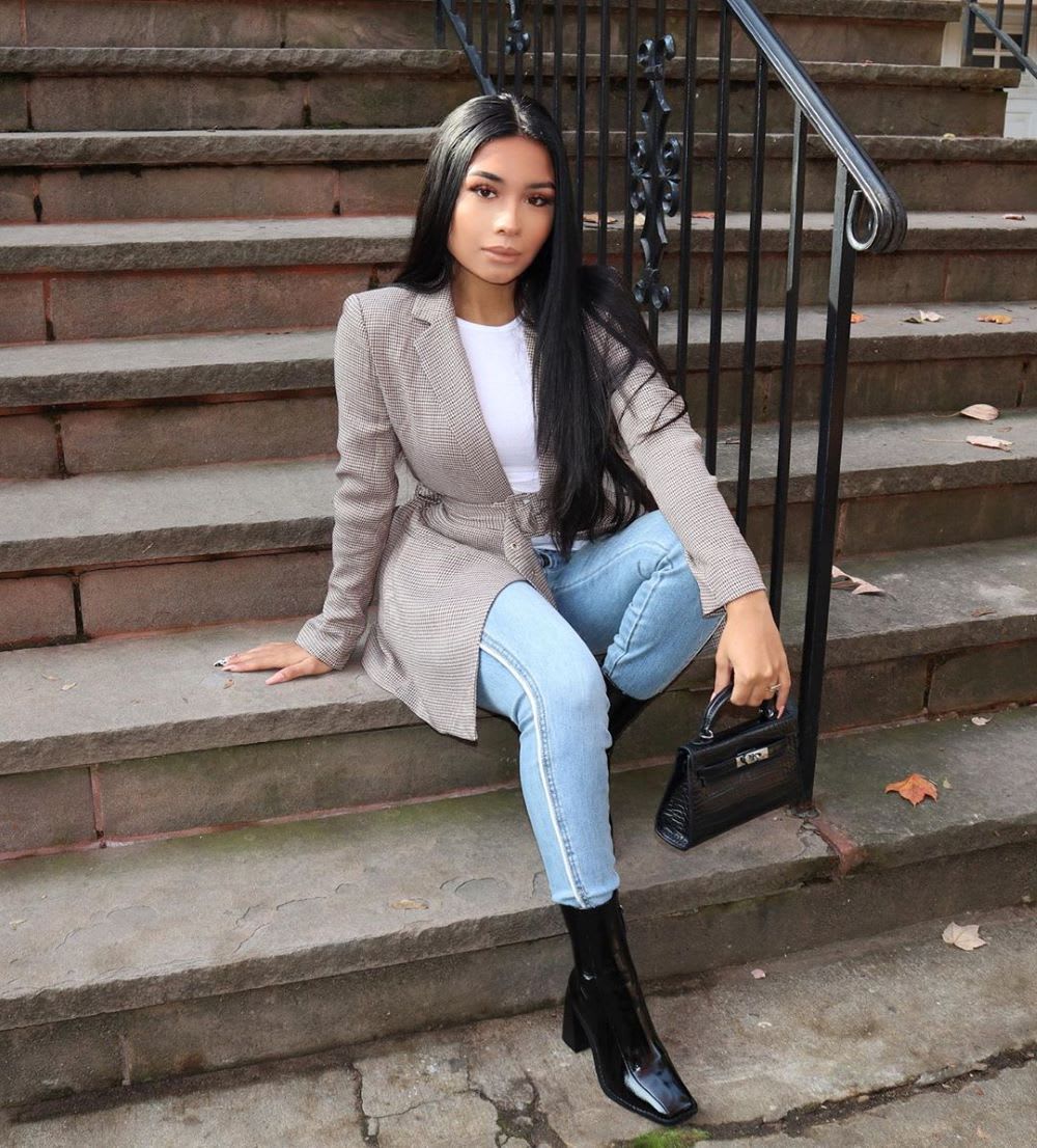 woman in blazer and jeans