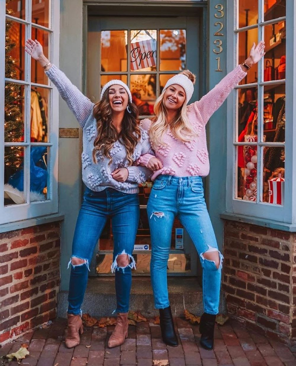 women in sweaters and knit beanies