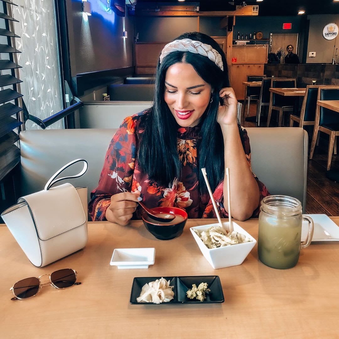woman at a table eating plant based