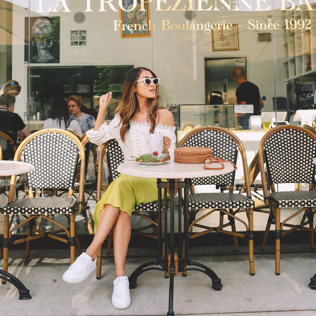 woman at a table outside plant based eating