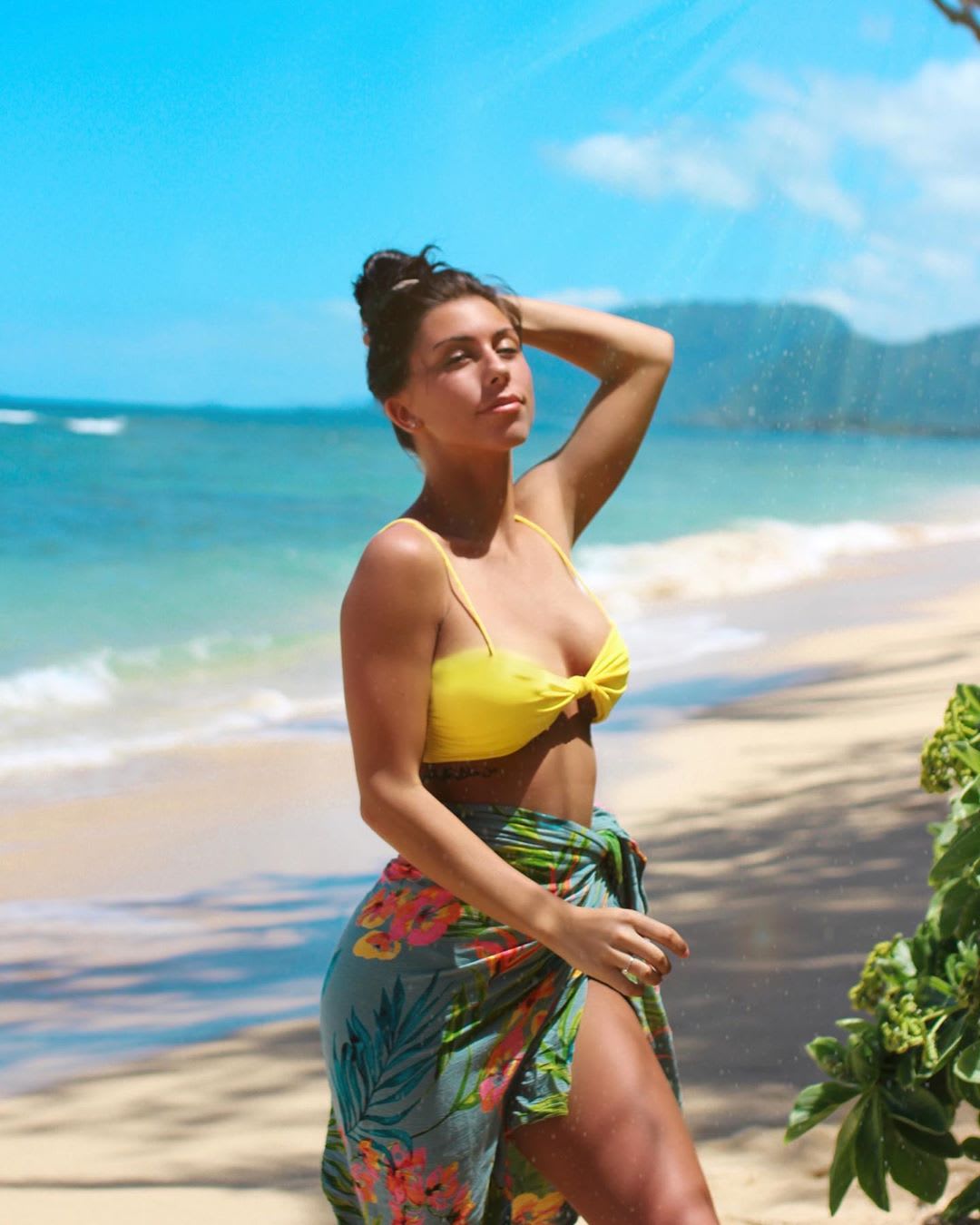 woman on the beach in a bikini and sarong: inexpensive places for spring break