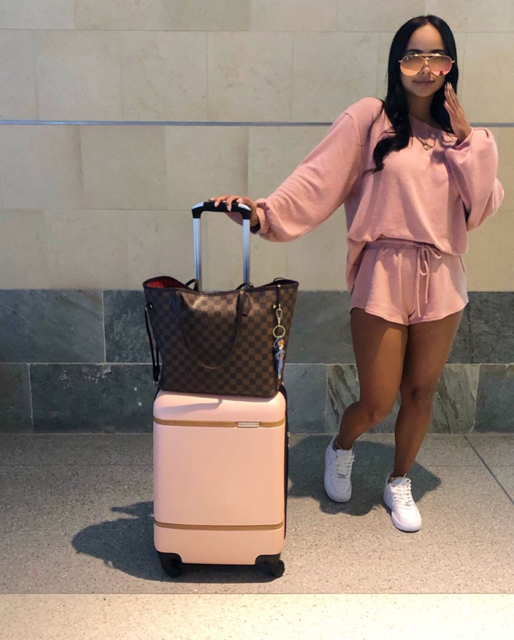 woman with a suitcase for how to survive a long flight