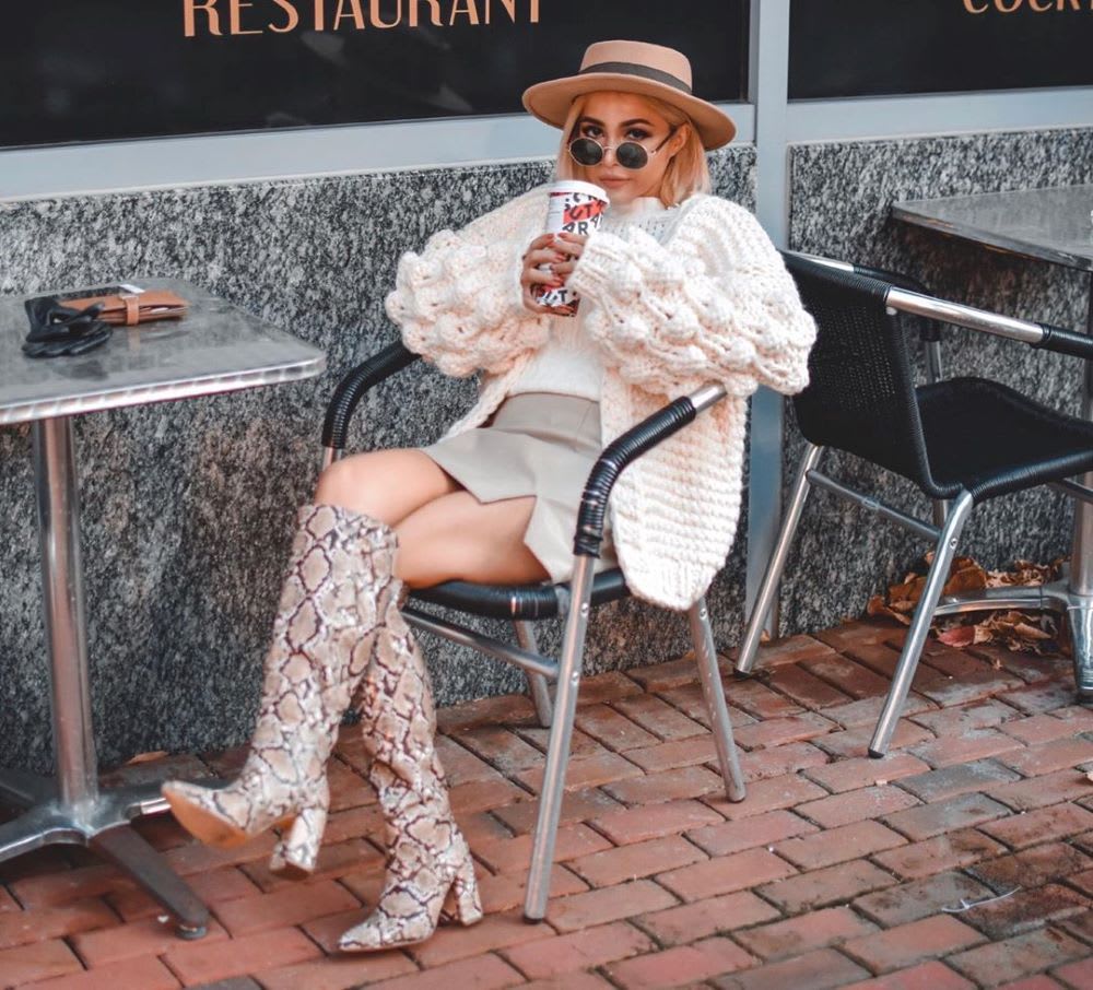 chunky cardigan with mini skirt and snake boots