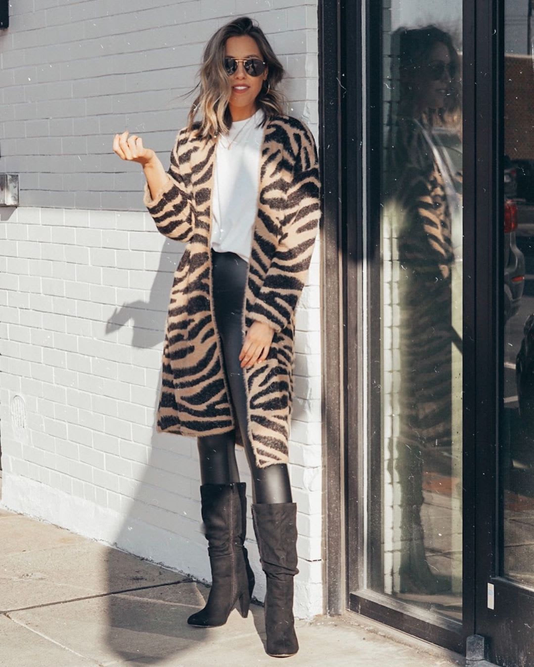 tiger stripe sweater with vegan leather leggings and boots