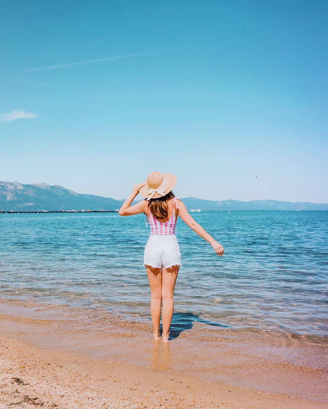 divorce tips and strategies: plan a vacation --woman on the beach facing ocean
