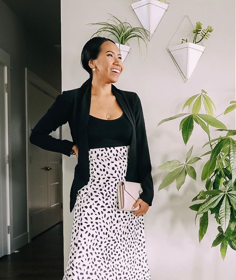 woman in blazer with professional hair pulled back