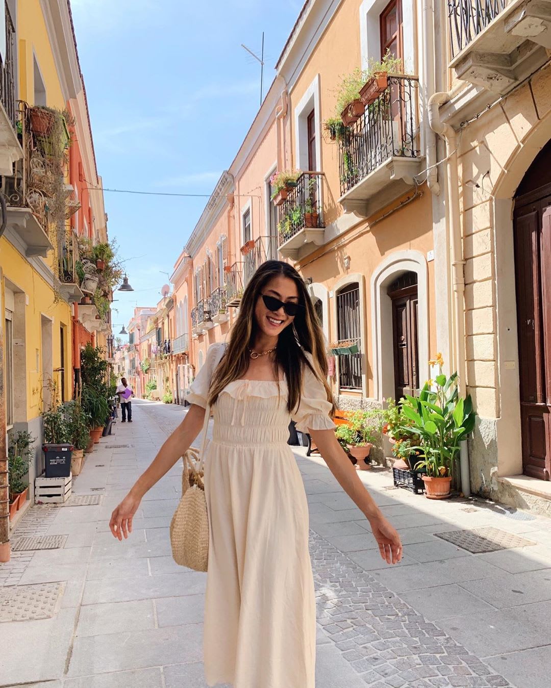 woman in smocked dress traveling