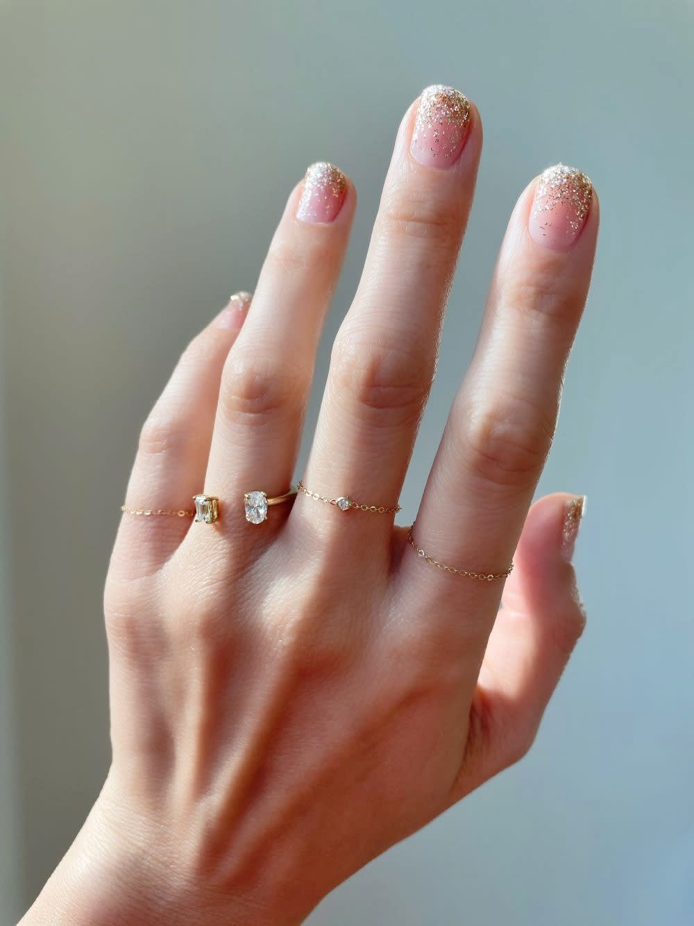 a DIY gold glitter gradient manicure