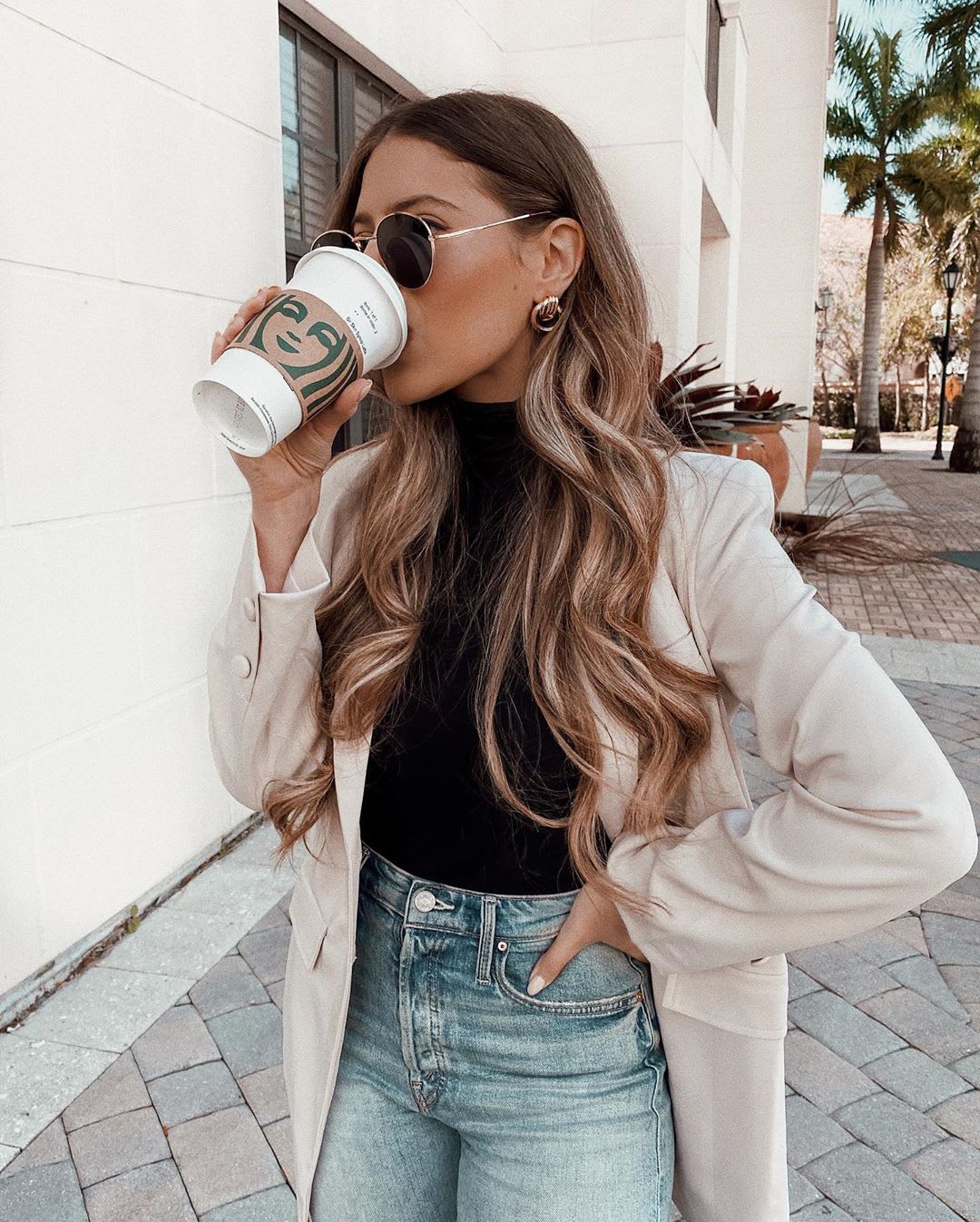 moving to a new city: a woman drinking coffee