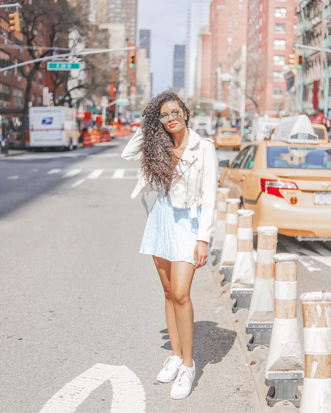 woman standing in a city street