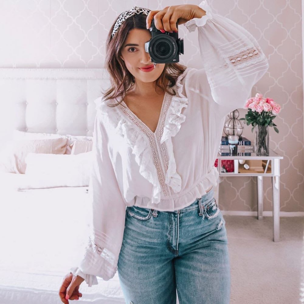 woman taking a photo with a camera