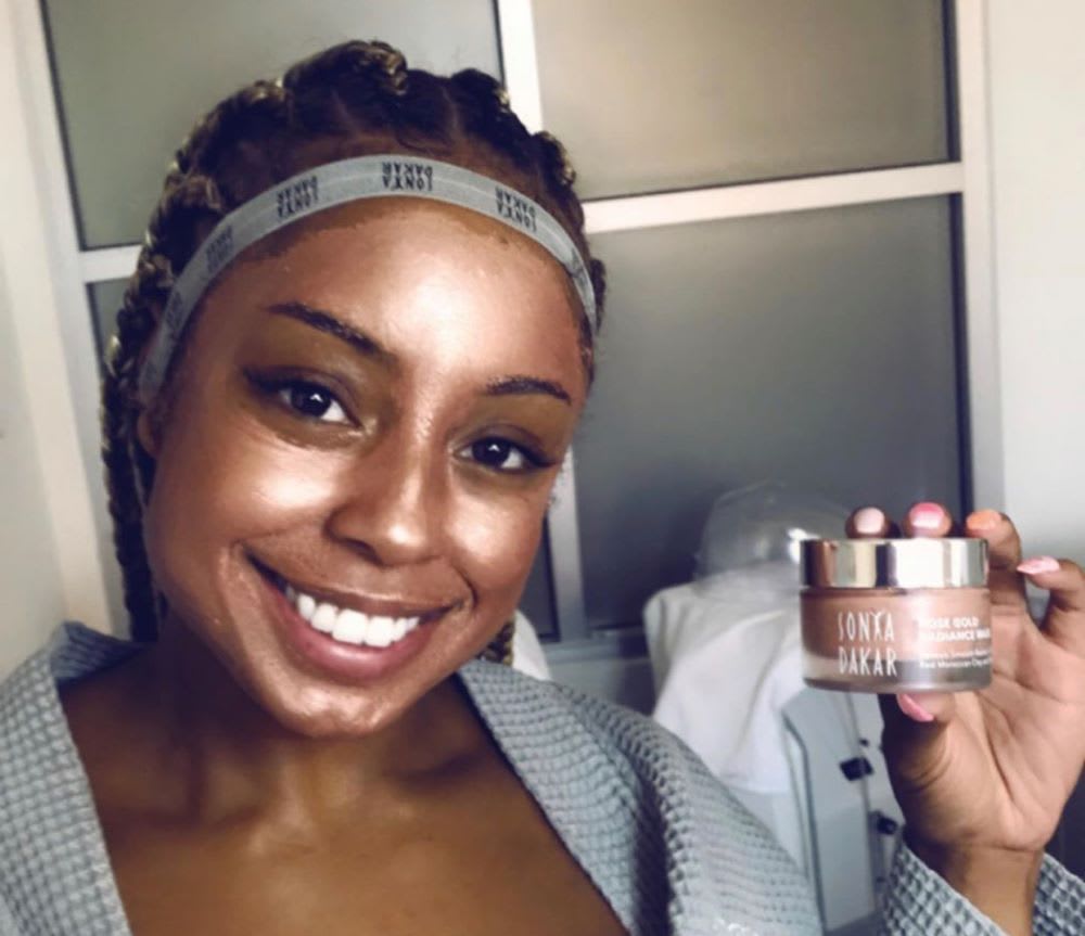 woman doing DIY facial with sonya dakar product
