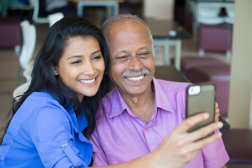 woman taking selfie with dad