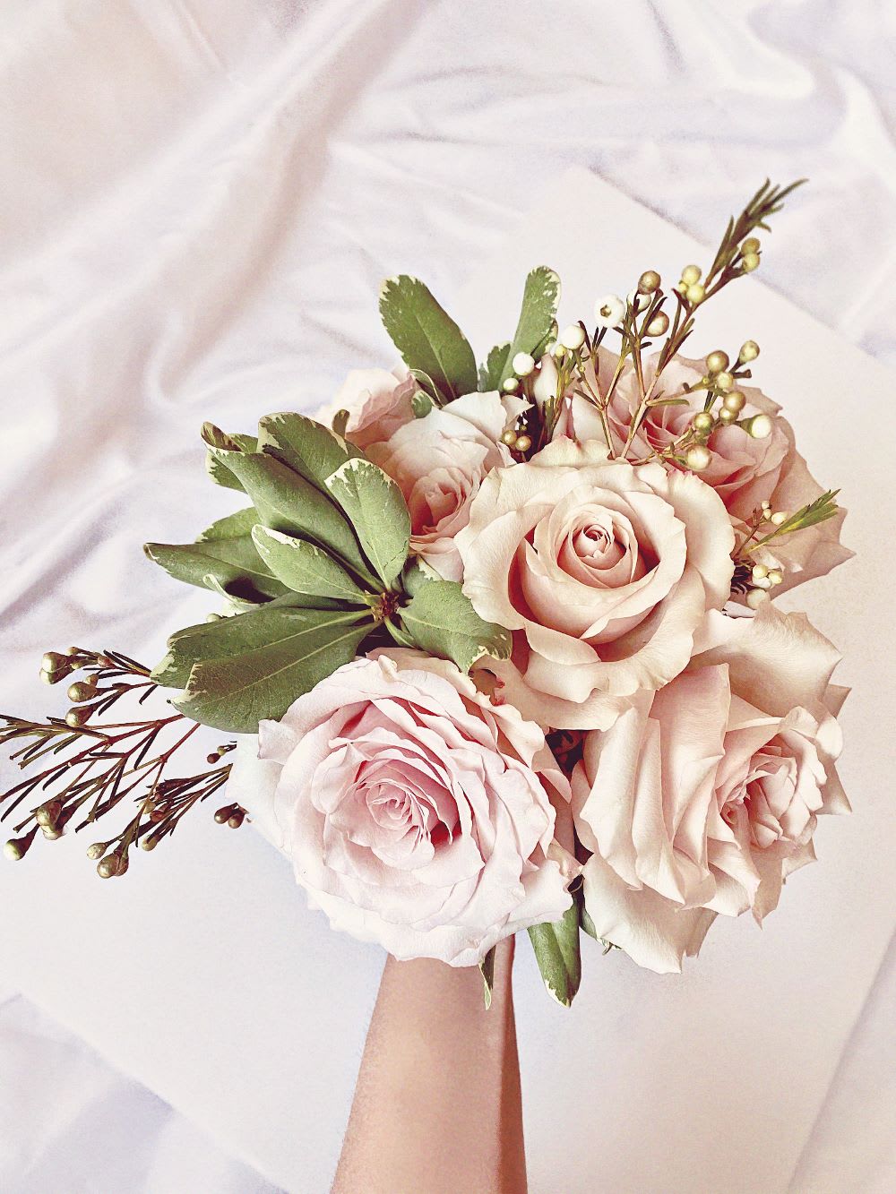 adding greenery to bouquet step for tutorial