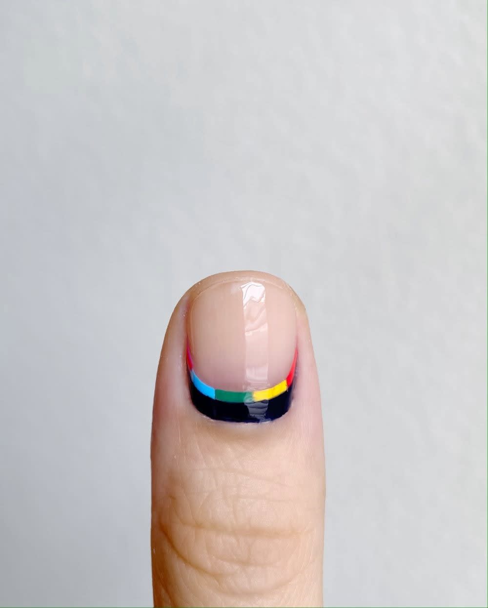black and rainbow reverse french nails